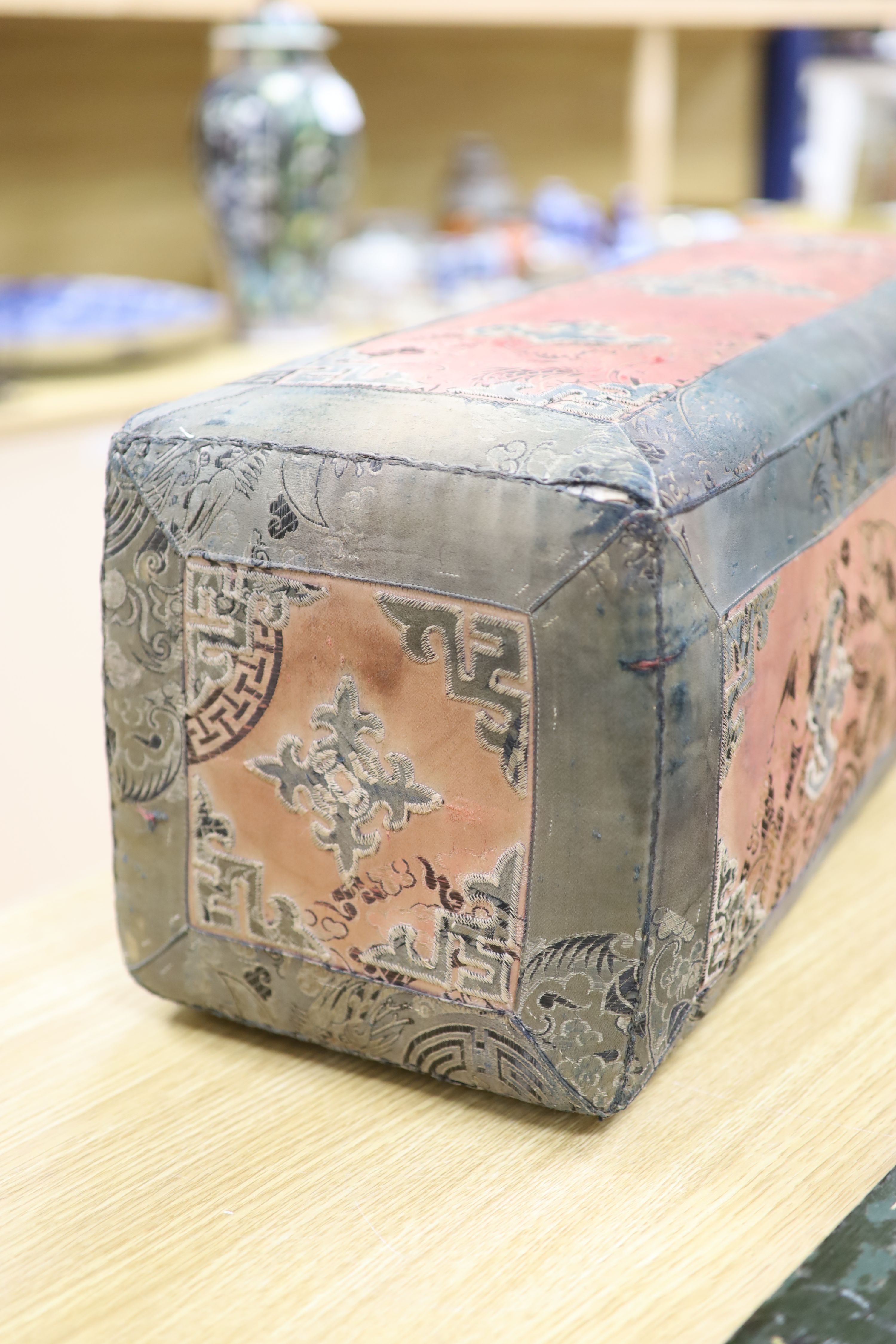 A 19th century Mongolian silk brocade and embroidered arm rest, length 73cm